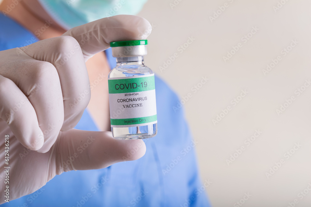 Doctors holding a bottle of covid-19 Coronavirus Doctors holding a bottle of covid-19 Coronavirus
