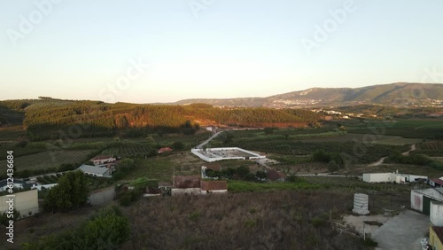 Aerial  of small countryside houses in a big field in Cadaval Portugal during the sunset photo