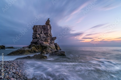 Sea Stack Rock Formation at Dalian's Coast during sunset © Yang Diao/Wirestock Creators