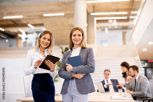 Two young business women lo...