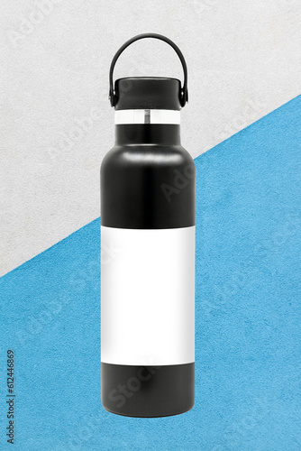 Black Empty Glossy Metal Thermos Water Bottle Isolated on White. 3d rendering photo