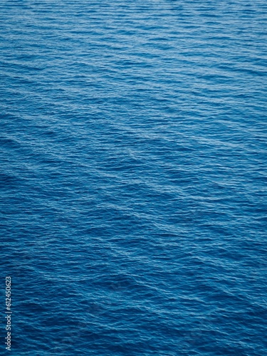 Vertical shot of the blue waves of the sea  can be used for wallpaper