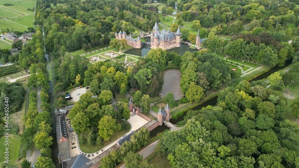 Scenic view of De Haar Castle with a beautifully green trees and gardens surroundings