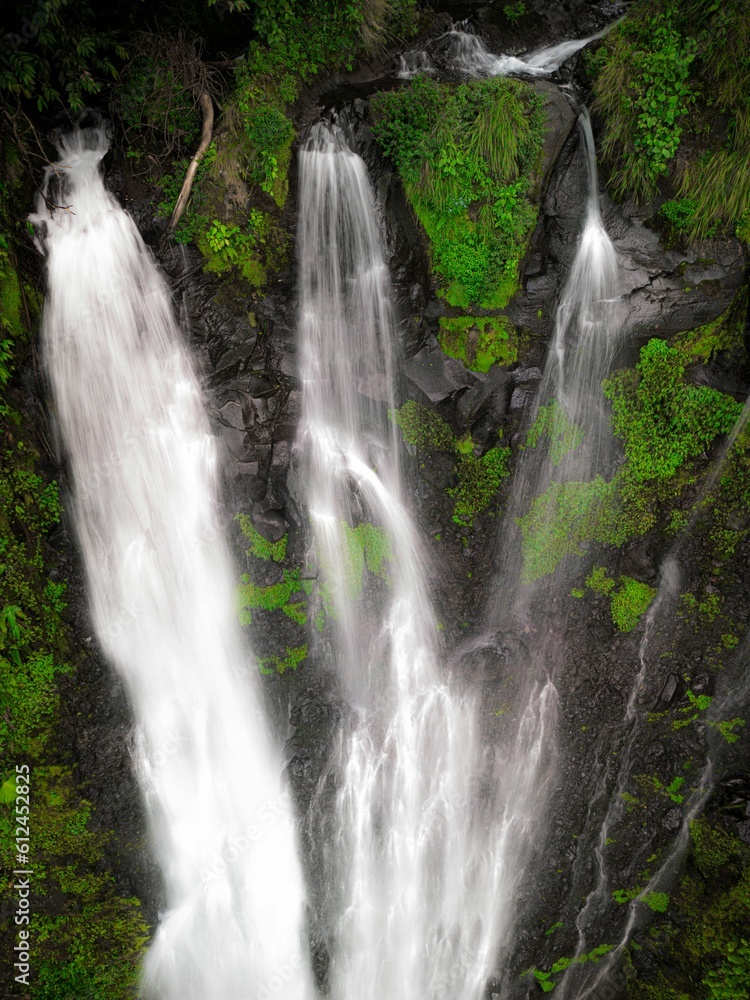 Obraz premium A high angle aerial shot of the Pozo Azul waterfall in Costa Rica