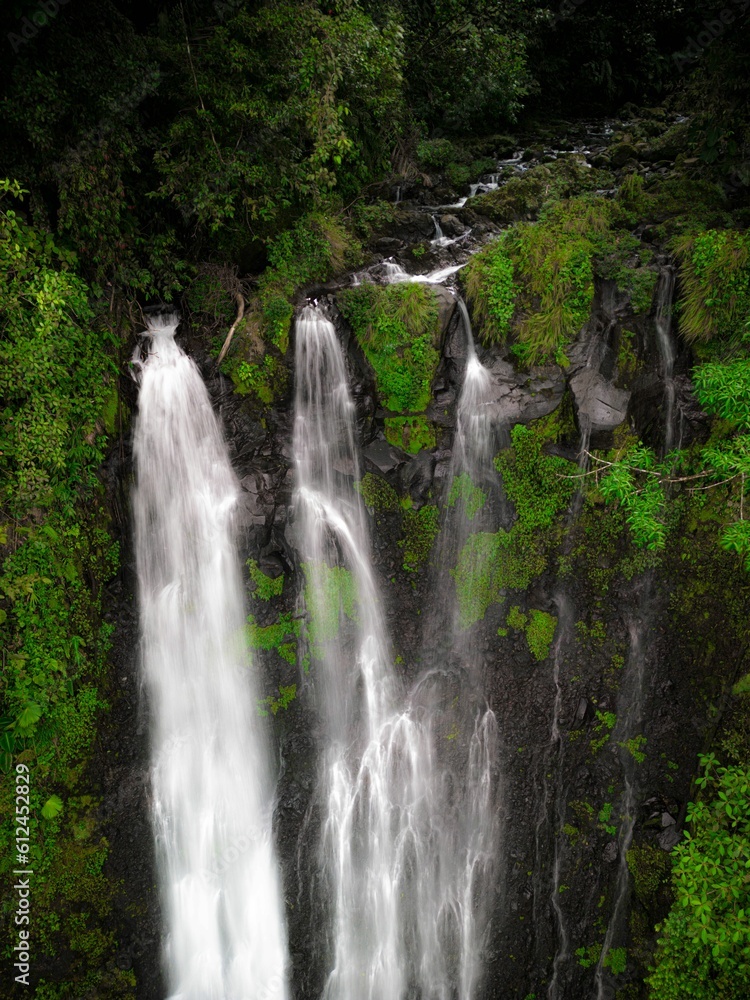 A high angle aerial shot of the Pozo Azul waterfall in Costa Rica