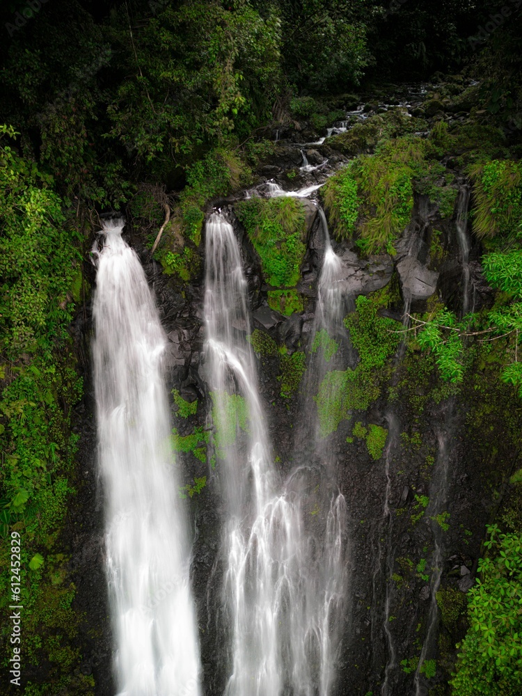 A high angle aerial shot of the Pozo Azul waterfall in Costa Rica A high angle aerial shot of the Pozo Azul waterfall in Costa Rica