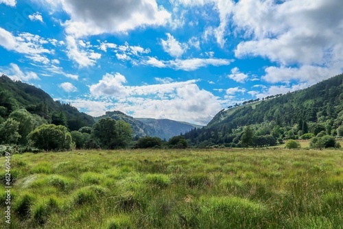 Beautiful Glendalough valley during summer with forests and mountains in the background