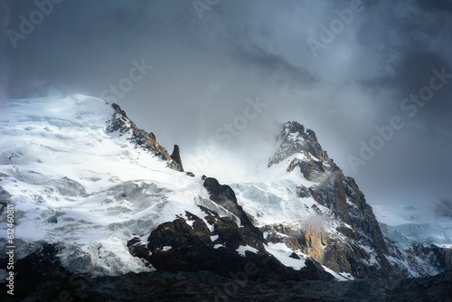 Breathtaking snowy mountain covered in fog