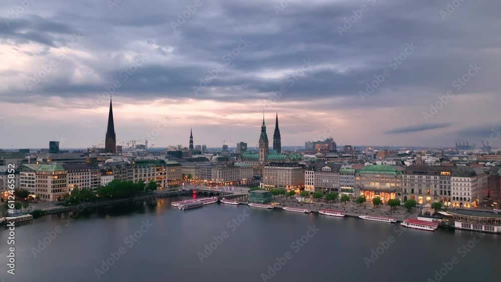 Aerial view over the Hamburg at sunset. drone flying over Alster lake. city skyline. Germany Aerial view over the Hamburg at sunset. drone flying over Alster lake. city skyline. Germany