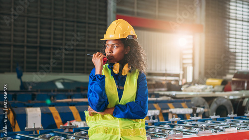 Portrait of Industrial technicians or The foramen will examine and check up on the machinery in the manufacturing facility. Technician working in the metal sheet business at a company. photo