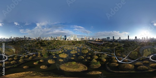 Panoramic shot of Benjakitti Park in Bangkok, Thailand with buildings in the background photo