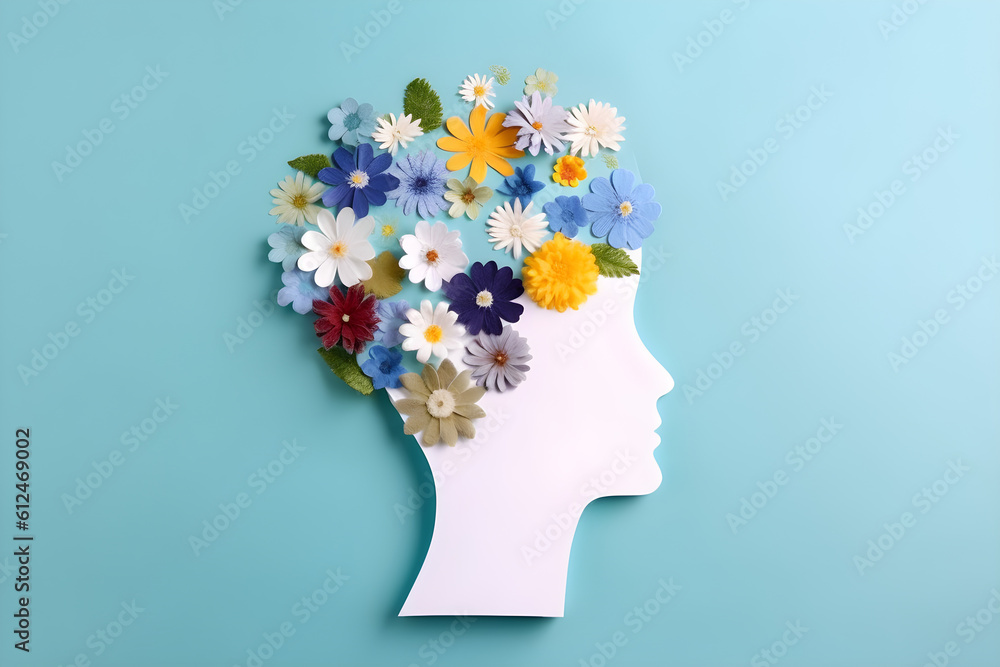 Caption a woman head with flowers in the shape of a human head 