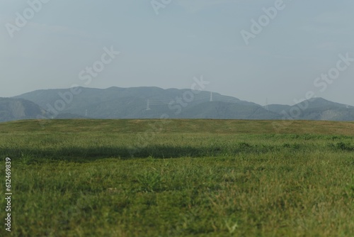 Beautiful view of a meadow with mountains in the background