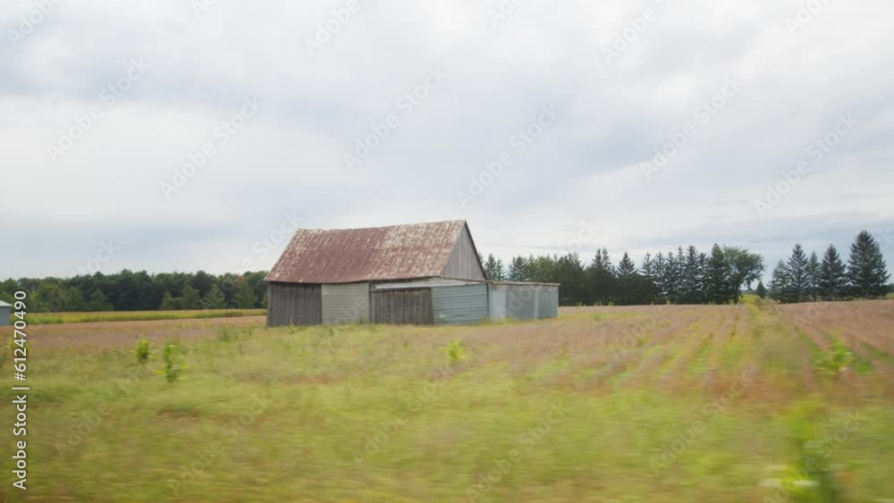 Beautiful rural field in the fall with a wooden shed in Quebec, Canada Beautiful rural field in the fall with a wooden shed in Quebec, Canada