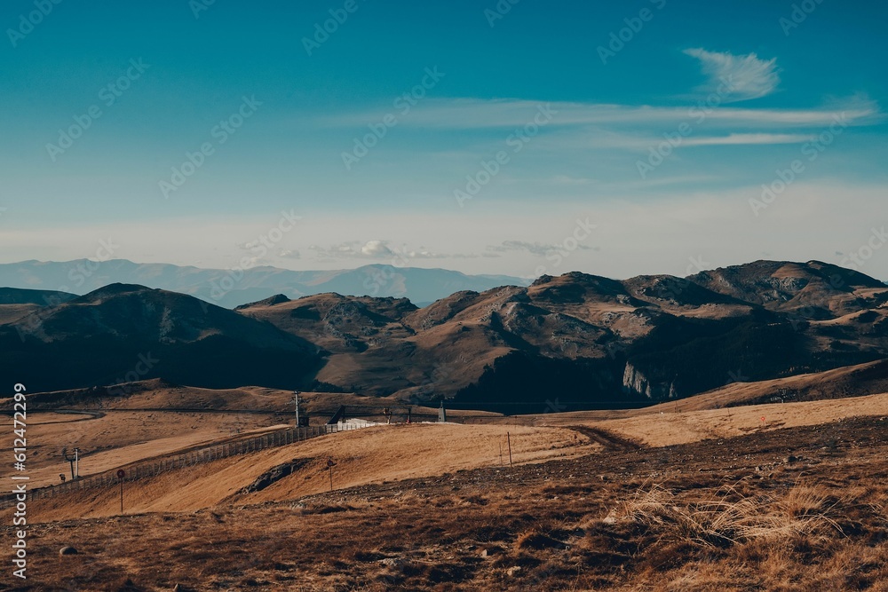 Landscape view with forested mountains, sky and clouds in the background Landscape view with forested mountains, sky and clouds in the background