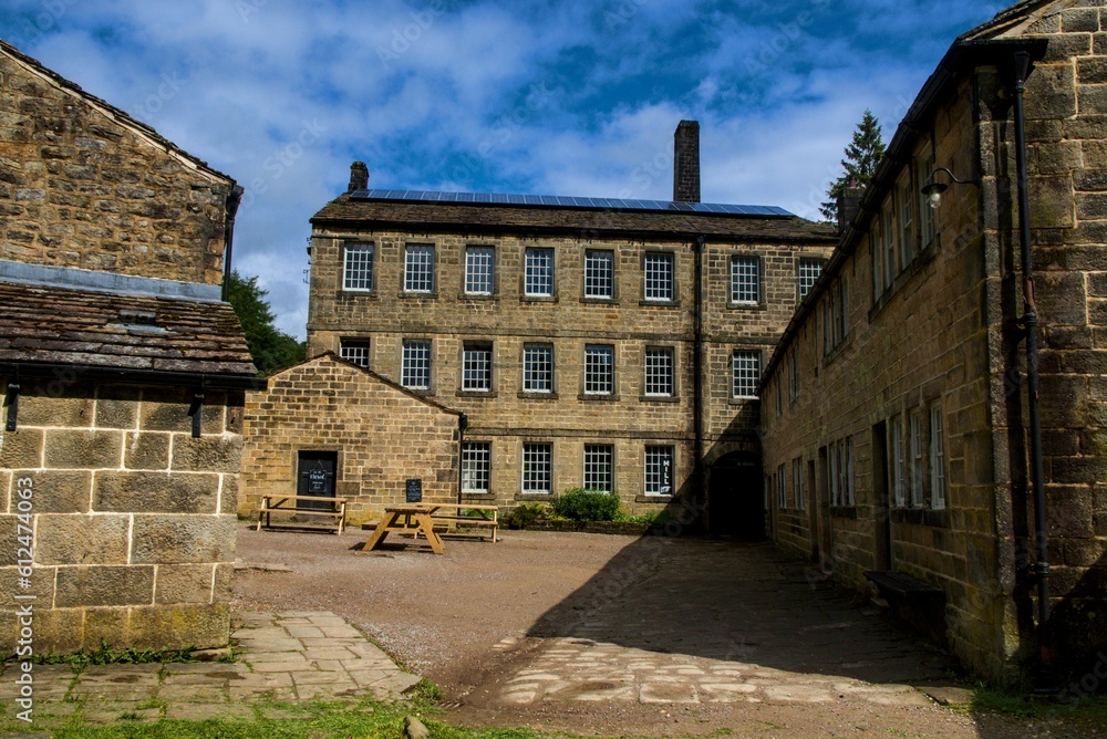 Landscape of stone Gibson Mill Museum in Calder Valley England under blue sky