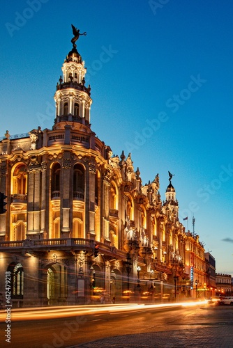 Vertical shot of the building of Grand theatre of Havana illuminated at night