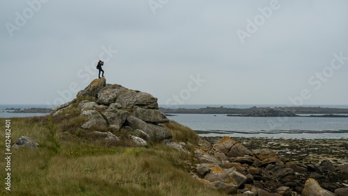 Beautiful shot of a person taking a photo of the view of the seascape