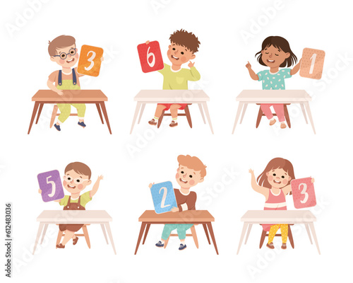 Little Children with Numbers Sitting at Desk Showing Card with Numeral Vector Set