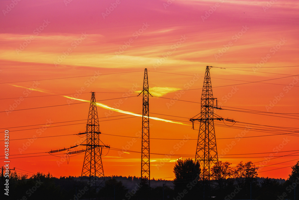 Three metal poles with power lines at sunset, anthropomorphic silhouette, industrial photography, golden hour photo, electric poles and wires, pulsating energy, beautiful sky after sunset