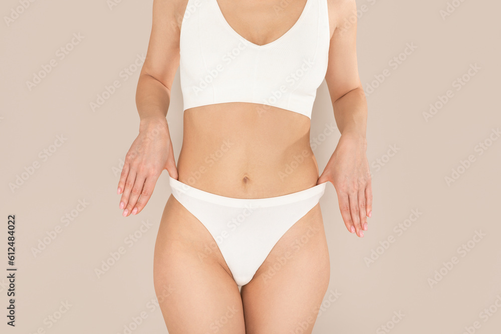 Unrecognizable well fit young woman posing in white underwear