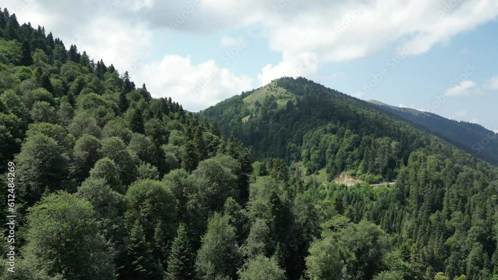 Aerial view of a road passing through a mountainous region Aerial view of a road passing through a mountainous region
