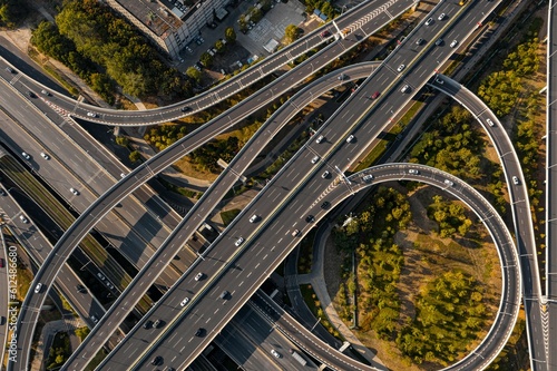 Aerial drone view of a traffic on a road junction in Wuhan on a sunny day photo