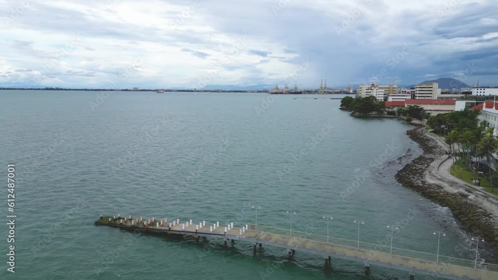 Drone view over a bridge on a lake connected to the coast Drone view over a bridge on a lake connected to the coast