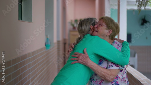 Photos Warm family reunion, adult daughter embracing elderly mother
