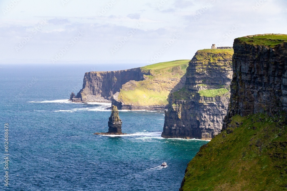 Cliffs of Moher along the peaceful shore on County Clare, Ireland