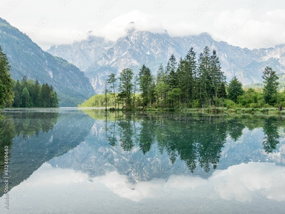 Beautiful shot of lake Alm reflecting the environment near the village Grunau im Almtal