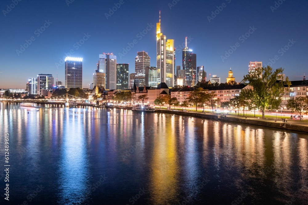 Evening skyline of Frankfurt across the river, Germany