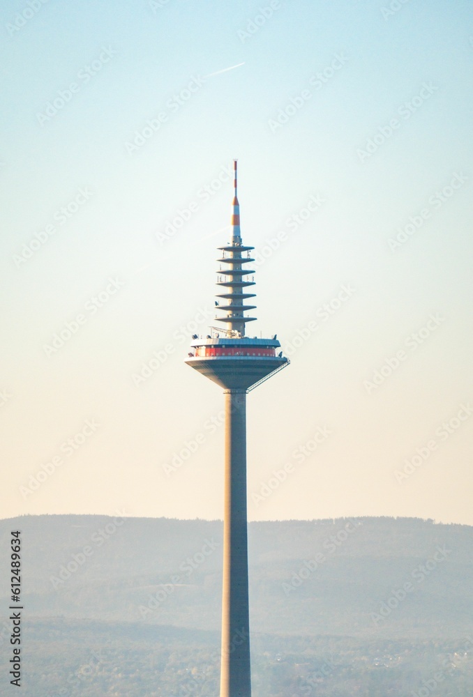 View of Europaturm TV tower in Frankfurt against sunrise sky background, Germany