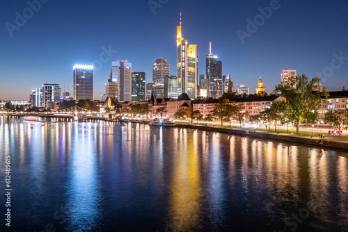 Evening skyline of Frankfurt across the river  Germany