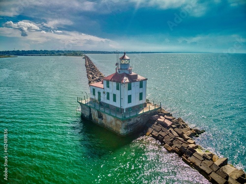 Drone shot of the Ashtabula Harbor Light building under a cloudy sky in Ohio, USA