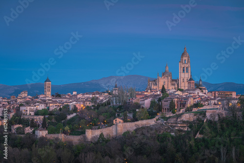 Segovia city skyline at dusk, with the cathedral and castle