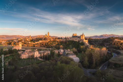 Segovia city skyline at dusk, with the cathedral and castle