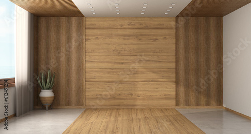 Empty room with wood paneling