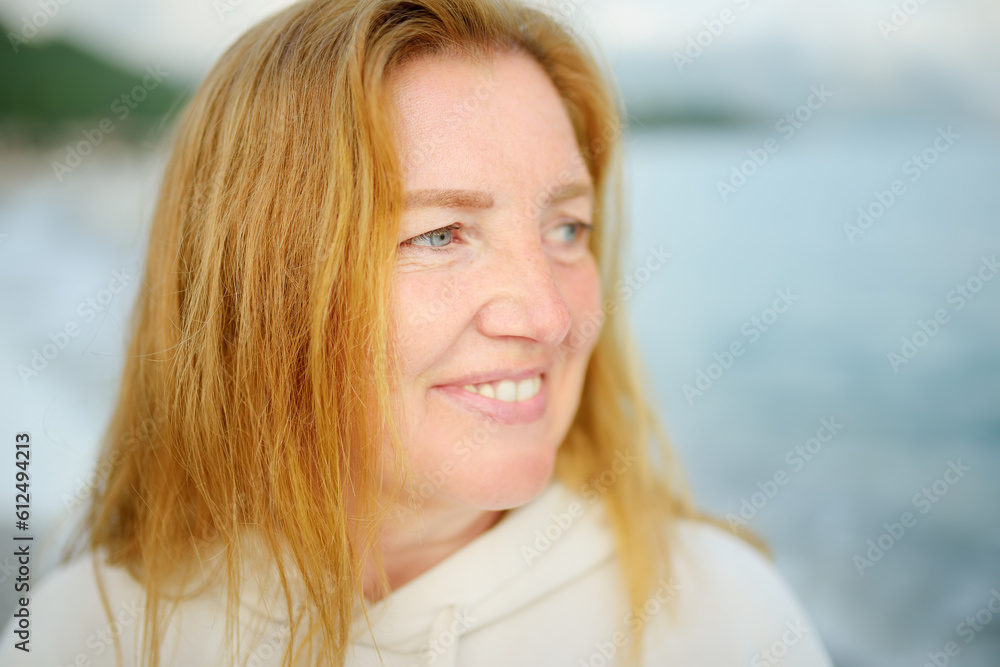 Portrait of a blue eyes and redheaded caucasian senior woman.