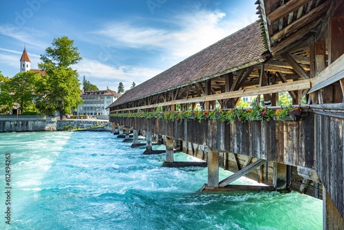 Beautiful Chapel bridge in Thun, Switzerland over a turquoise lake