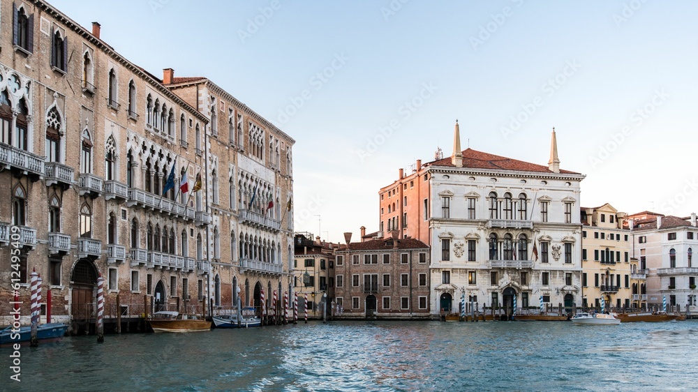 Beautiful lake surrounded by gorgeous buildings in Venice, Italy under a clear bright sky