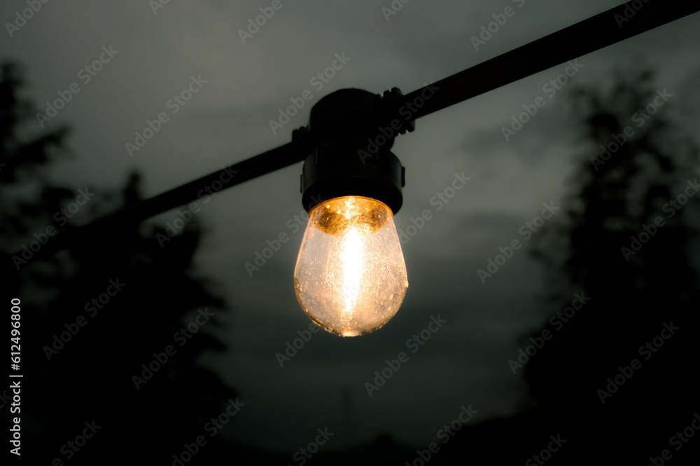 Closeup of glowing bulb in street
