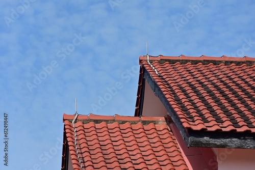 Building with red roofs against the blue sky