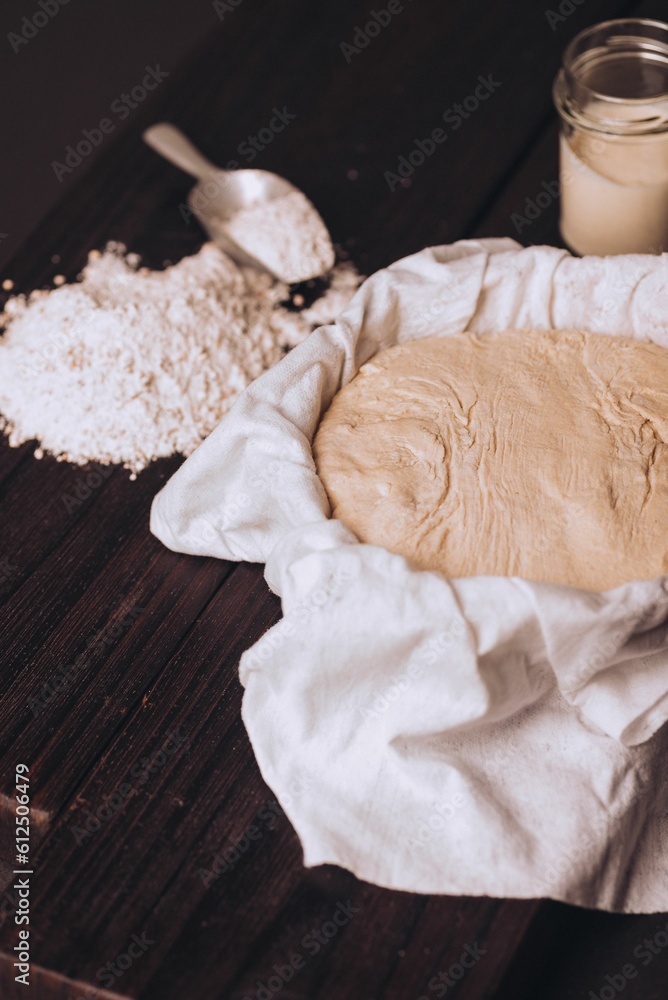 Dough with flour on table