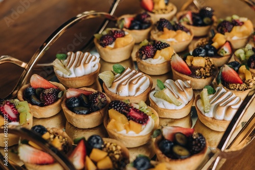 pastries with fruit on a metal tray on a table