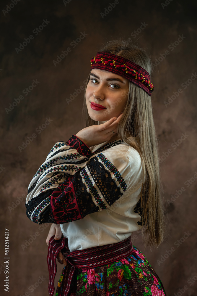 ukrainian young woman wear vyshyvanka traditional Ukrainian clothing on black background