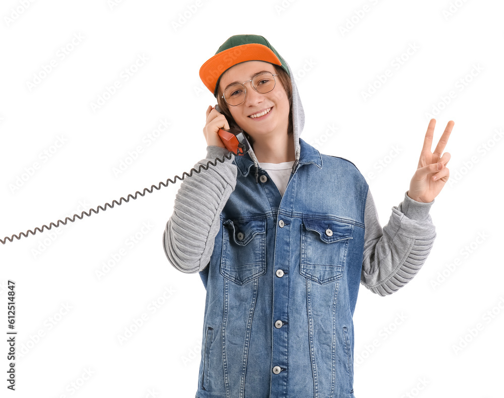 Cool teenage boy talking by telephone on white background Cool teenage boy talking by telephone on white background