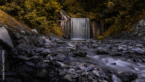 Scenic waterfall in a foresst photo