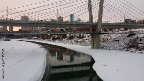 Beautiful drone view of the Tawatina Bridge over the partially frozen river in Edmonton, Alberta photo