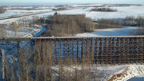 Aerial footage of the Rochfort Trestle Bridge in Alberta, Canada in winter photo